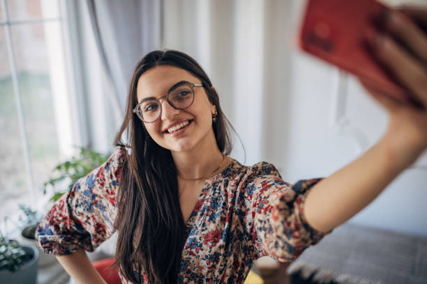 istock Woman taking a selfie 1477906677