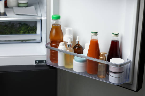 istock Different cosmetic products on shelf in refrigerator 1477906762