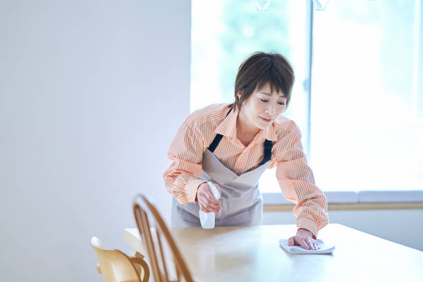 istock Woman wiping the dining table 1477907236