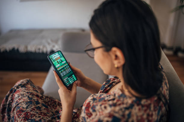 Woman having fun gambling online stock photo