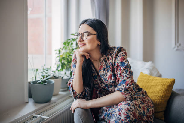 istock Young woman sitting at home 1477908880