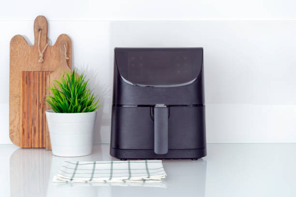 Airfryer on tidy modern kitchen countertop.