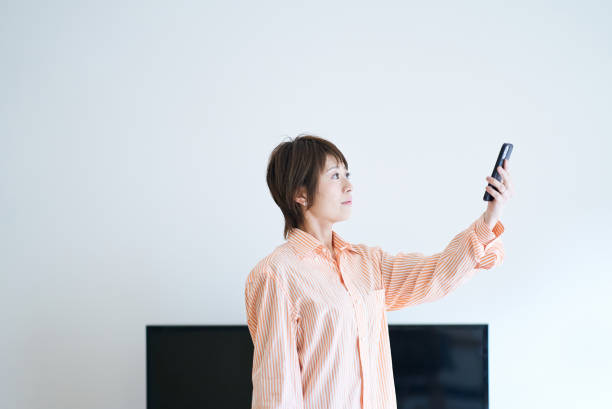 istock A woman holding a smartphone 1477914203