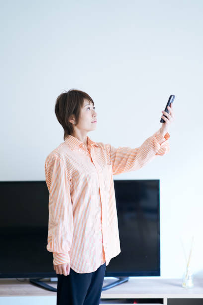 A woman holding a smartphone