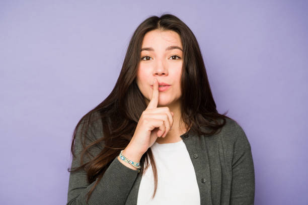 istock Mysterious woman keeping a secret 1477916834