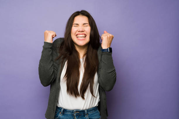 istock Successful woman celebrating feeling happy 1477916988