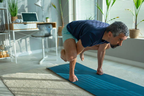 istock Mature athlete doing at-home isometric exercises to stay fit. 1477918449