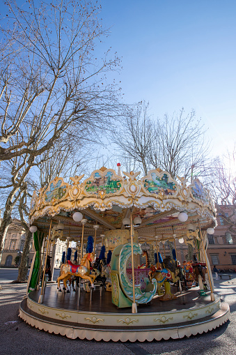 Colorful carousel  on Piazza Napoleone in historic center of Lucca, Italy