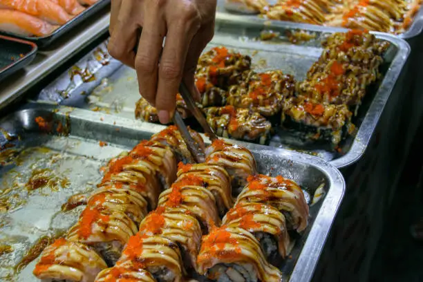 Photo of sushi uramaki from traditional food market and bazar in Thailand