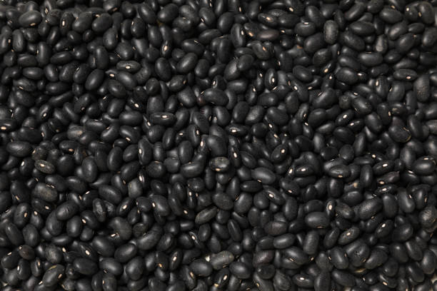 istock Heap of black beans on a white background 1477924682