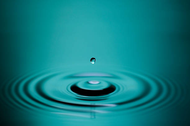 istock Water droplets and ripples falling on the surface of the water 1477935751