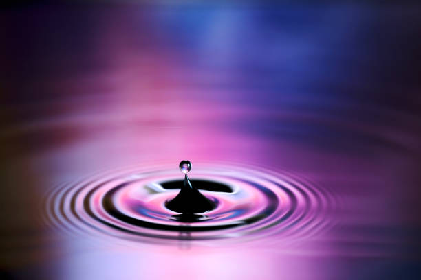 istock Water droplets and ripples falling on the surface of the water 1477935752