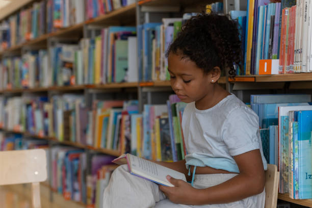 istock Schoolers in the library 1477940506