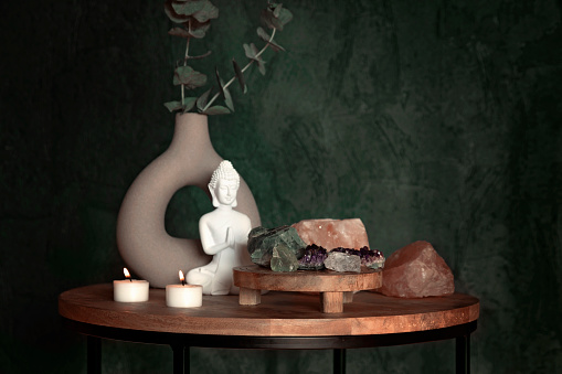 Buddha statue, himalayan rock salt candle holder and gemstones. Balance and calm energy flow at  home, purifying the air,  decrease stress level concept