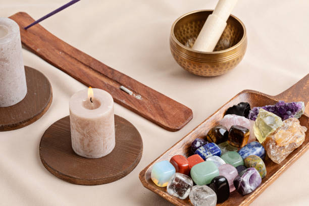 istock Healing reiki chakra crystals over fabric background. Gemstones for wellbeing, harmony, meditation, relaxation, metaphysical, spiritual practices. Energetical power concept 1477940922
