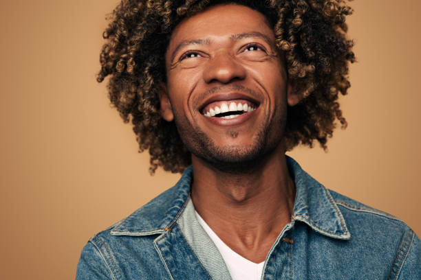 istock African American man laughing at joke 1477941271