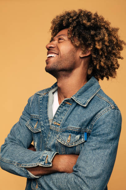 istock Happy black man laughing at joke 1477941315