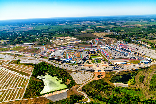 Austin, United States - September 29, 2022:  Aerial view of the Circuit of the Americas Formula One  race track located just outside of downtown Austin, Texas shot from an altitude of about 1200 feet from an orbiting helicopter.