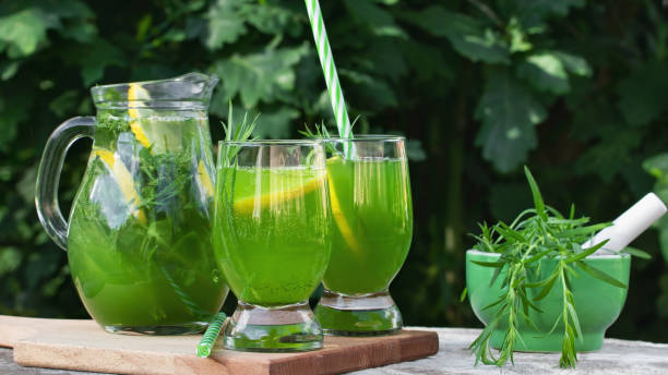 istock Homemade summer refreshing tarragon lemon drink on patio table 1477957971