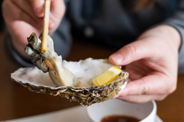 istock Fresh raw oysters served in their shell ready to eat 1477961845