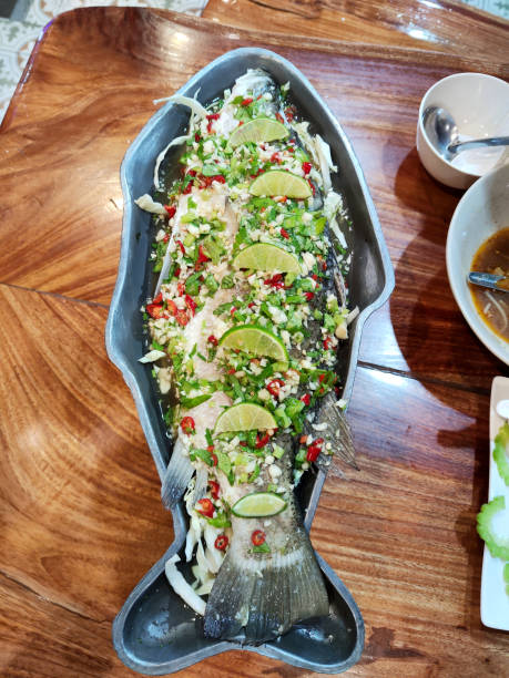 Thai steamed fish with lime and garlic, Bangkok