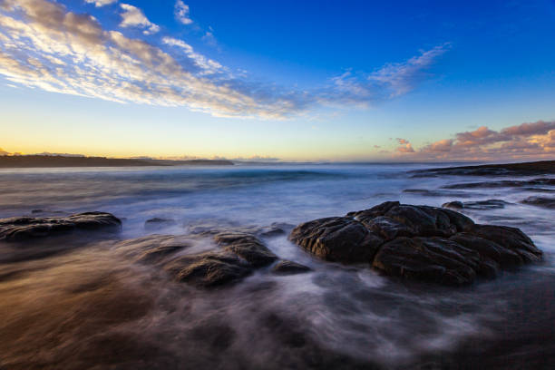 istock Waves and rocks long exposure seascape with dramatic sky 1477968800