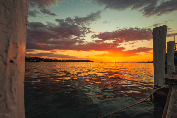 istock Sunrise over the ocean viewed from a wharf 1477968833