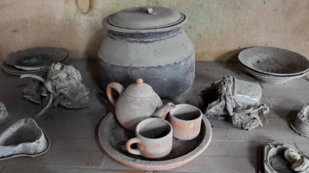 istock Old wooden cupboard with dirty and old clay pots 1477977998