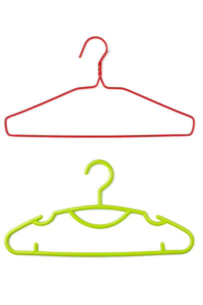 istock Pink plastic and green plastic clothes hanger on white 1477986986