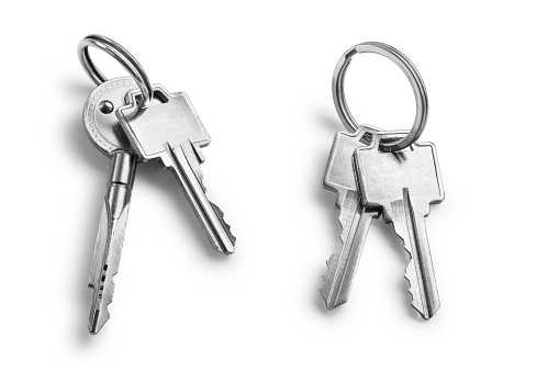 Bunch of keys with rings on white background