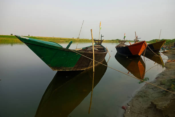 istock Wooden boats in Padma River with water reflection 1477990149