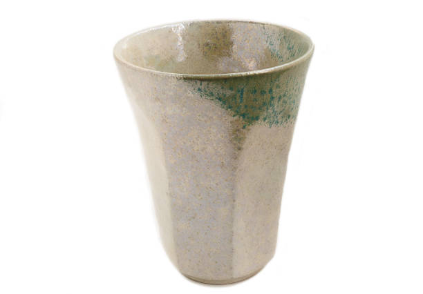 istock Empty handmade ceramic cup, antique tea cup on a white background. handcraft concept. 1477993016