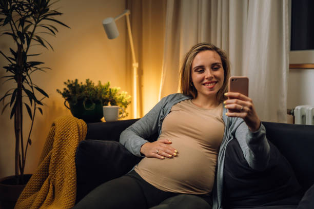 istock pregnant woman at home 1477994756