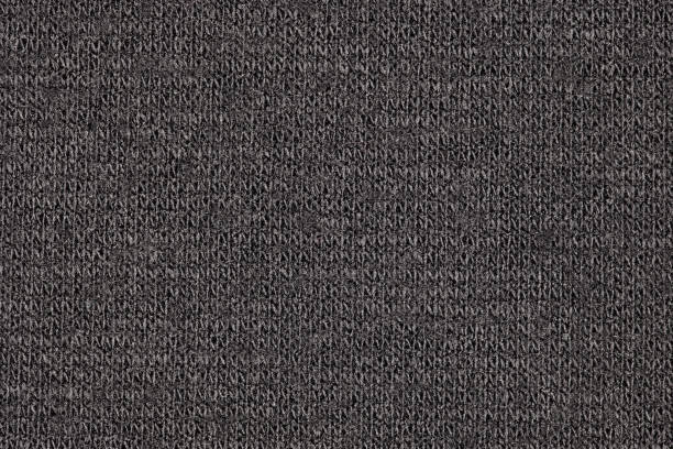 istock Black synthetic fabric close-up, uniform texture background 1477995997