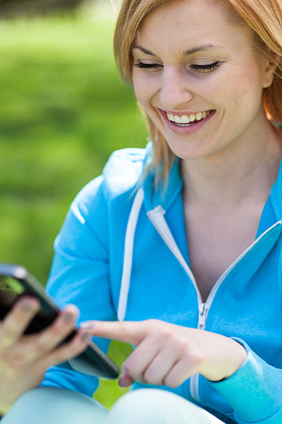 istock Woman using digital tablet outdoors 147799687