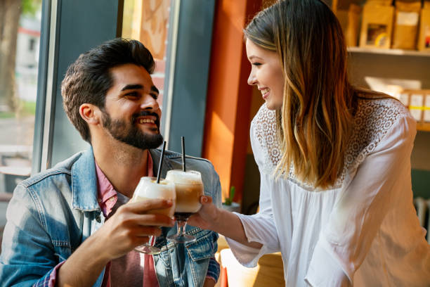 istock Romantic couple in cafe is drinking coffee and enjoying being together 1478004268