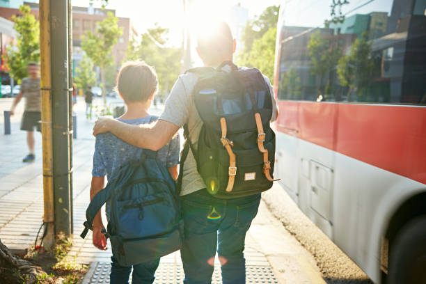istock Father and son riding public transportation together 1478004450