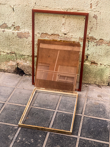High angle view of empty picture frame left in the street