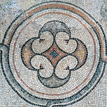Medieval mosaic of small faded color marbles composed in a circular shape with arches, on floor of Basilica of Sant'Eufemia in Grado, Italy dating back to 4th century