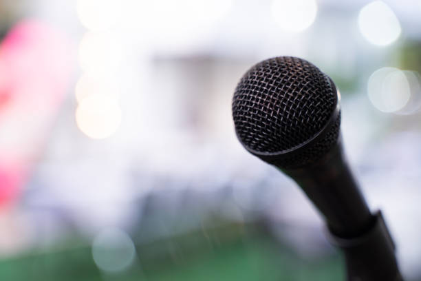 istock microphone in seminar room or lighting in meeting room bokeh light background 1478011427