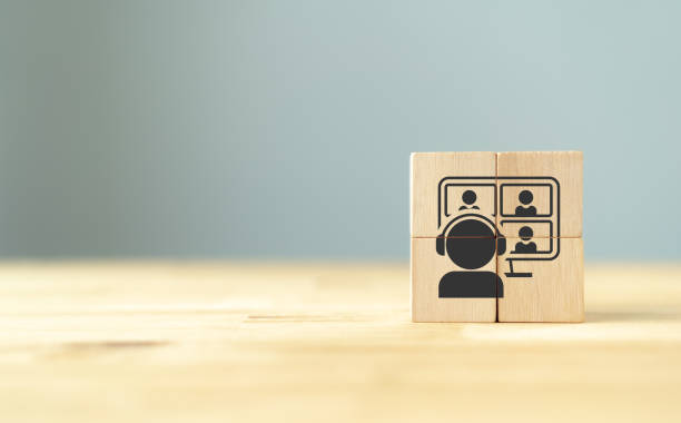 istock Webinar, online meeting, digital classroom, online teaching concept. Work from home, hybrid workplace, video conference, online meeting, e learning and online interview icon on wooden cube blocks. 1478013207