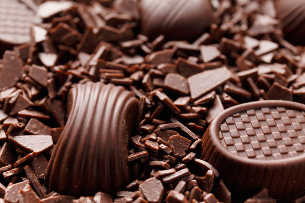 istock Candies in chocolate chips close-up macro photography. 1478015084