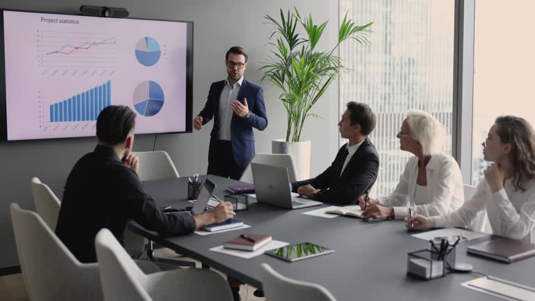 Business trainer or company boss make presentation for entrepreneurs