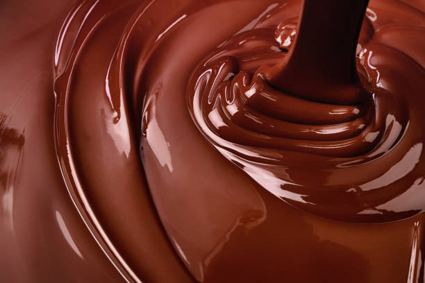 istock melt dark chocolate background. pouring liquid cocoa dessert 1478020555