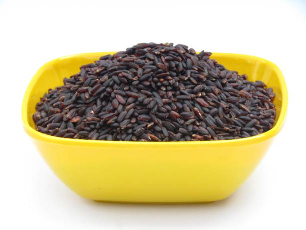 istock Black rice in a yellow bowl on white background 1478020943