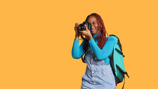 istock Happy girl using dslr camera for images 1478023266