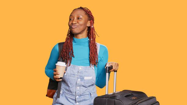 istock Smiling traveller drinking cup of coffee 1478023639