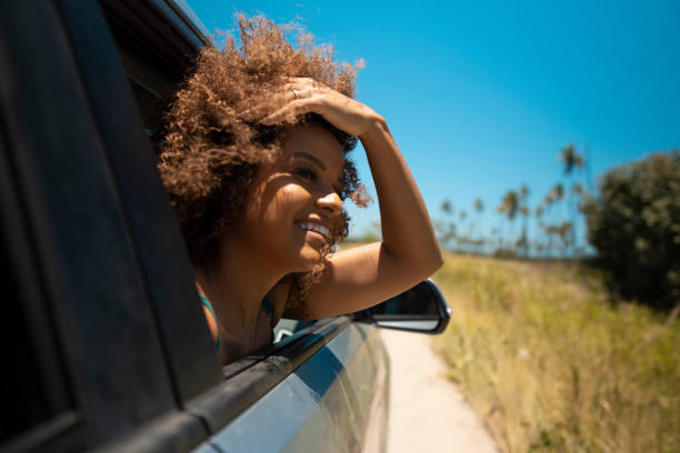 istock Woman at car window looking at view 1478027310