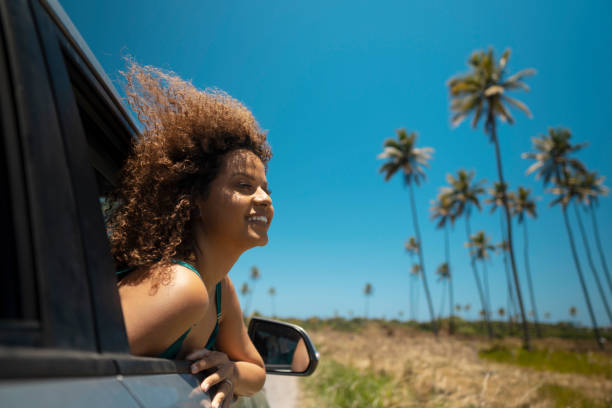 istock Woman enjoying car trip 1478027326
