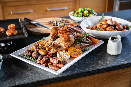 Turkey Christmas lunch with all the trimmings. Pigs in blanket, stuffing, gravy, brussls sprouts, and roast potatoes